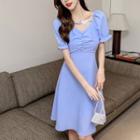 Short-sleeve Butterfly-accent A-line Dress