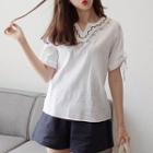 Cutout-neckline Tie-cuff Embroidered Top