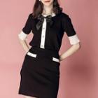 Set: Ribbon-front Buttoned Knit Top + Knit A-line Skirt
