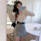 Long-sleeve Buttoned Knit Top / Plaid Mini A-line Skirt