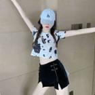 Short-sleeve Cow Print Cropped T-shirt / Frog-button Slit Shorts