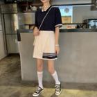 Collared Short-sleeve T-shirt / Striped Mini A-line Skirt