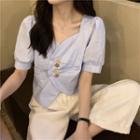Short-sleeve Irregular Buttoned Blouse