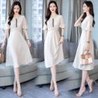 Short-sleeve Embroidered Twisted A-line Dress