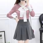 Set: Long-sleeve Bow-accent Knit Sweater + High-waist Plain Pleated Skirt