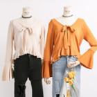 Dip-back Tie-neckline Ruffled Knit Top