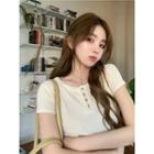 Short-sleeve Henley Knit Top / Pleated Mini A-line Skirt
