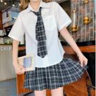 Set: Short-sleeve Plain Shirt + Plaid High-waist Skirt + Tie