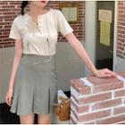 Short-sleeve Henley T-shirt / Mini Pleated Skirt