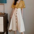 V-neck Short-sleeve Blouse / Buttoned Midi A-line Skirt