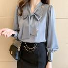 Lantern-sleeve Ribbon Tie-neck Blouse / Ruffle Hem Midi Pencil Skirt