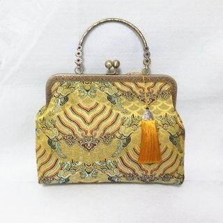 Patterned Tasseled Clipframe Clutch