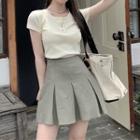 Short-sleeve Henley Top / Pleated Mini A-line Skirt