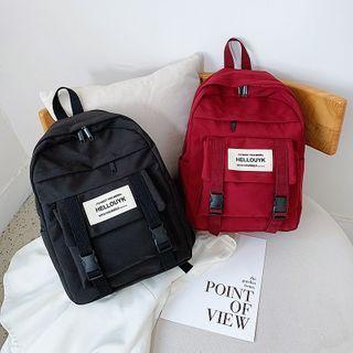 Label Applique Buckled Canvas Backpack
