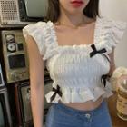 Sleeveless Tie Accent Ruffled Blouse
