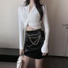 Long-sleeve Twisted Plain Top / High-waist Faux Leather Chain Accent A-line Skirt