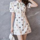 Short-sleeve Butterfly Print Tie-neck Frill Trim Mini A-line Dress