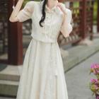 Set: Puff-sleeve Frog Buttoned Blouse + Tasseled Midi A-line Skirt