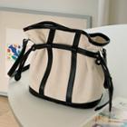 Contrast-piping Bucket Bag