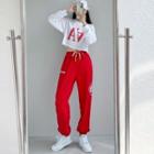 Set : Long-sleeve Lettering Cropped T-shirt + Drawstring Gathered Cuff Pants