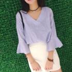 Ruffle 3/4-sleeve V-neck Blouse