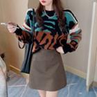 Patterned Sweater / Mini A-line Faux Leather Skirt
