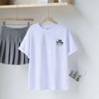 Short-sleeve Lettering T-shirt / Mini Pleated Skirt