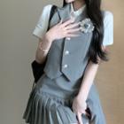 Plain Vest / Pleated Skirt / Short-sleeve Shirt / Brooch
