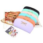 Bow-accent Wristlet