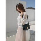 Push-lock Cowhide Crossbody Bag