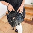 Fringed Quilted Flap Backpack