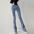 Mid Rise Cross Print Bootcut Jeans