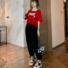 Lettering Short-sleeve T-shirt / Plain Harem Pants