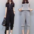 Set: Cut-out Short-sleeve T-shirt + Cropped Harem Pants