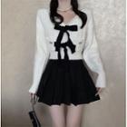V-neck Bow-accent Cable Knitted Crop Cardigan / High Waist Pleated Mini Skirt