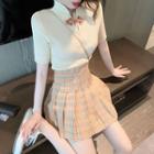 Short-sleeve Knit Top / Plaid Pleated Skirt