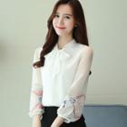 Long-sleeve Embroidered Tie-neck Blouse