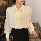 Long-sleeve Faux Pearl Trim Bow Blouse Beige - One Size