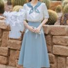 Set: Short-sleeve Embroidered Bow-collar Blouse + Midi A-line Skirt