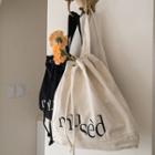 Letter-embroidered Drawstring Backpack