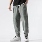 Drawstring-waist Letter Embroidered Cropped Sweatpants