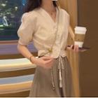 Puff-sleeve Tasseled Blouse / Midi A-line Skirt