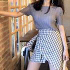 Plain Short-sleeve Top / Plaid Irregular A-line Skirt