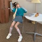 Short-sleeve Printed T-shirt + Mesh Long-sleeve Top + Plaid Mini Skirt