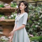 Short-sleeve Bow Faux Pearl Embellished A-line Dress