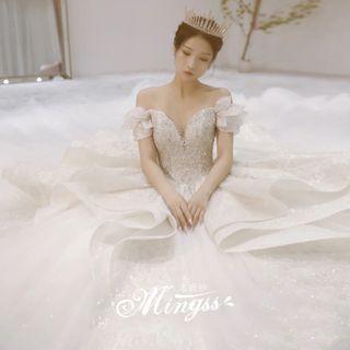 Off-shoulder Embellished Ruffled A-line Wedding Gown