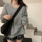 Long-sleeve Embroidered V-neck Sweatshirt / Plaid Pleated Mini Skirt
