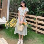 Set: Short-sleeve Plaid Blouse + Midi A-line Skirt