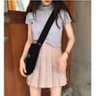 Short-sleeve Cropped Polo Shirt / Plaid A-line Mini Pleated Skirt