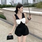 Set: V-neck Sleeveless Bow-accent Pearl Strap Zip Up Back Top + High Waist Mini Wide Leg Shorts